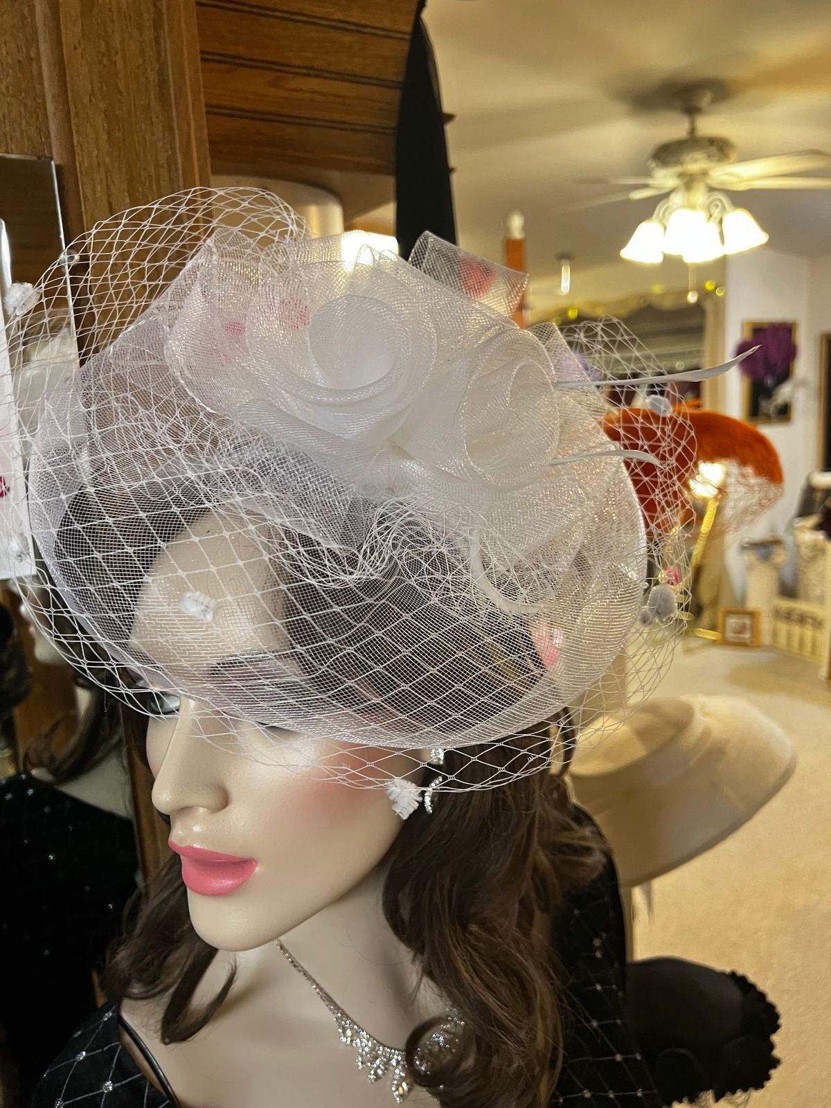 Fascinator in White, veil and roses