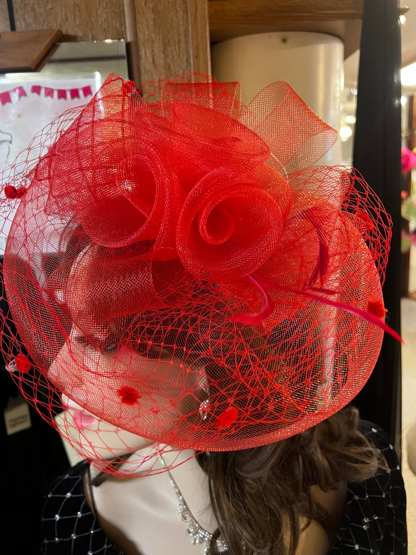 Fascinator in red, veil and roses