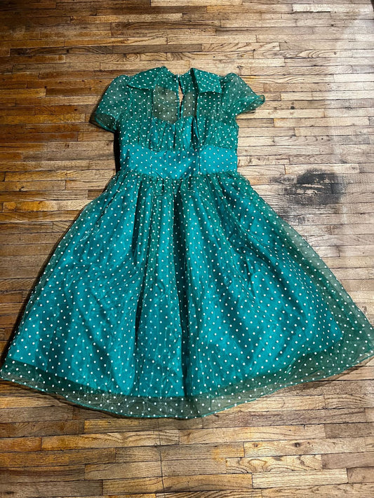 Green and white polka dot with a look of 1940s and 1950s flare
